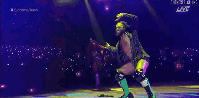a man and woman are dancing on a stage .