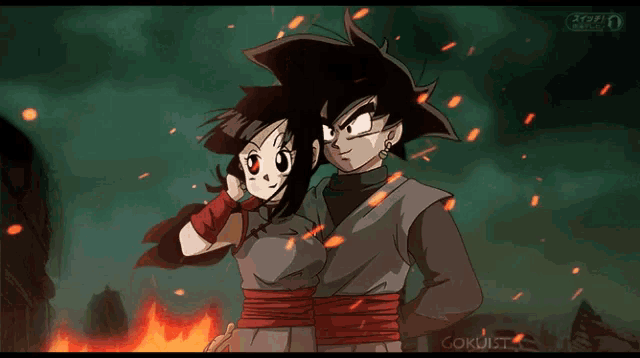 a couple of anime characters standing next to each other with the letters goku on the bottom right