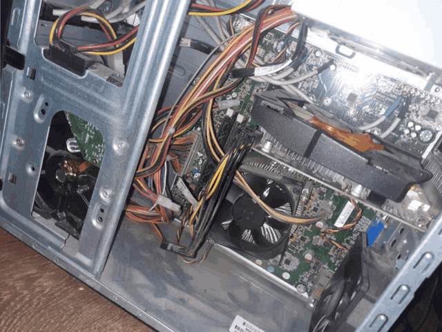 the inside of a computer with a sticker that says ' warning '