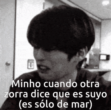 a black and white photo of a man with a caption that says minho cuando otra zorra dice que es suyo .