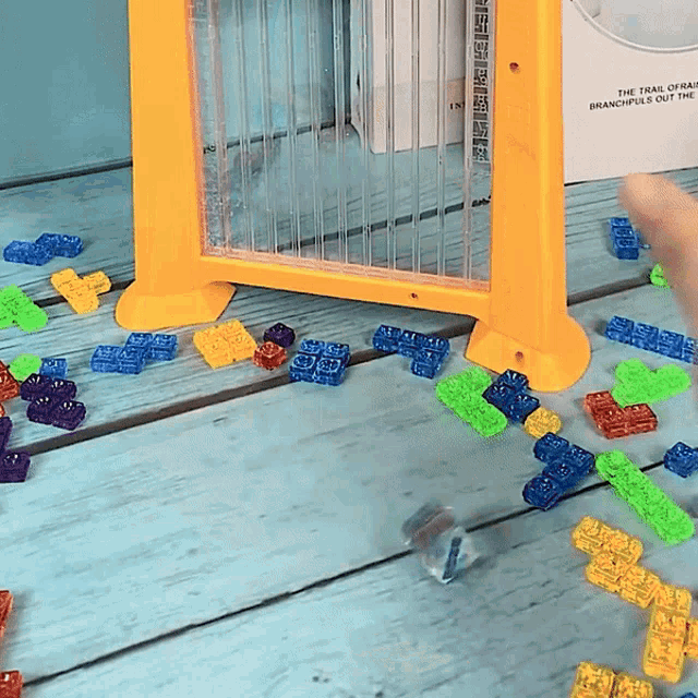 a person is playing with a toy that says ' they 're magnetic ' on it