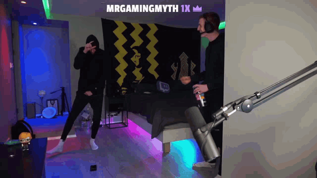 two men are dancing in front of a microphone with the words mrgamingmyth 1x above them