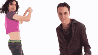 a man and a woman are dancing together and the woman is wearing a crop top