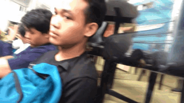 a blurry picture of a man with a blue bag