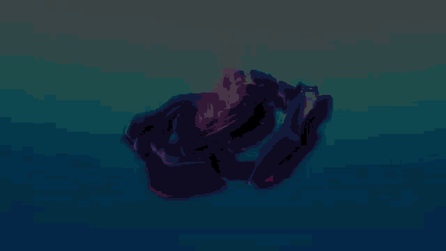 a purple and blue object is floating in the air