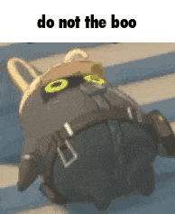 a cartoon character is laying on the floor with the words `` do not the boo '' written above it .