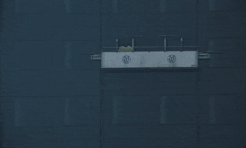 a black building with a white sign on the side that says ntv