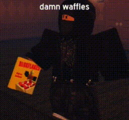 a person is holding a box of waffles in their hand