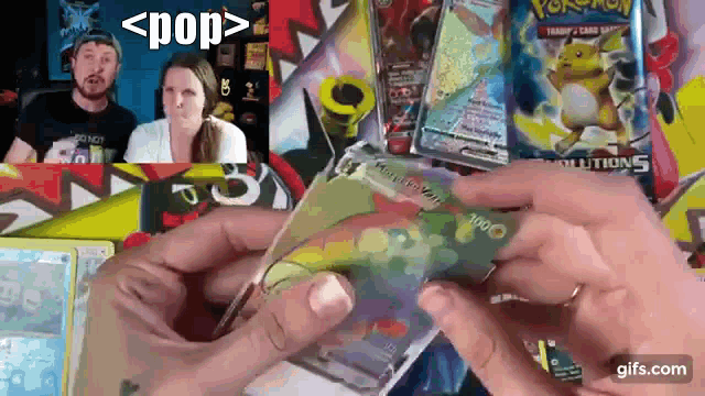 a person is holding a pokemon card in front of a group of people