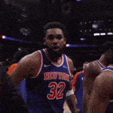a man wearing a new york jersey with the number 2 on it