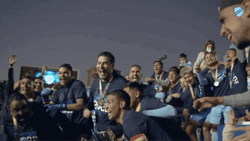 a group of soccer players wearing shirts with the number 22 on them are celebrating