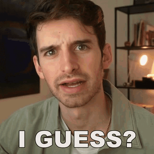 a man with a beard says " i guess " in front of him