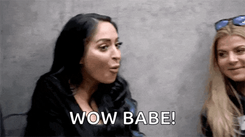 two women are sitting next to each other and one of them is talking to the other .