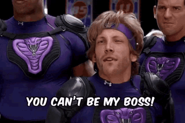 a man wearing a purple shirt with a cobra on it says you can 't be my boss
