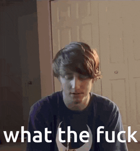 a young man is wearing a shirt that says what the fuck on it
