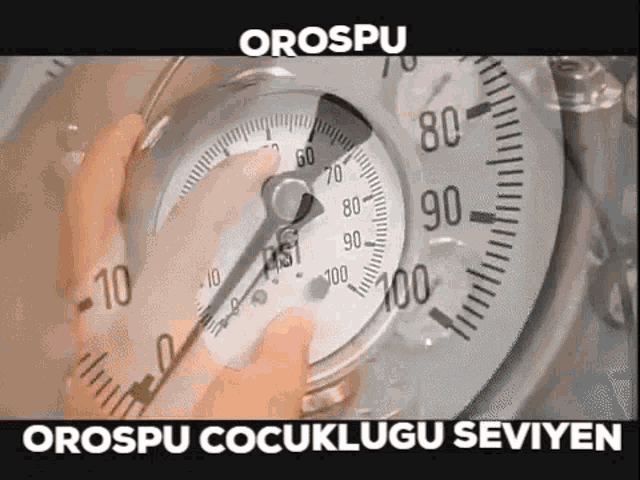 a person is holding a gauge with the word orospu written on it