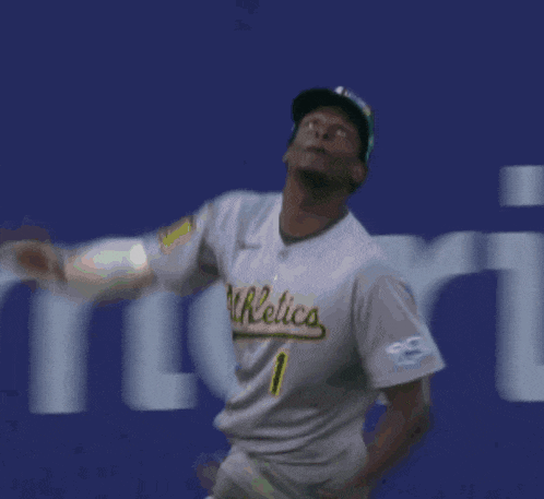 a blurry picture of a baseball player throwing a ball in front of a sign that says zero