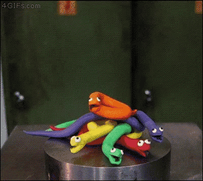 a rainbow colored object is being pressed by a machine with the website 4gifs.com on the bottom