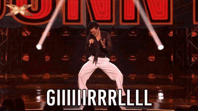 a man is dancing on a stage with the words giiiiirrlll written on it