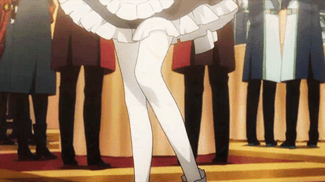 a woman in a maid costume is standing in front of a crowd of people
