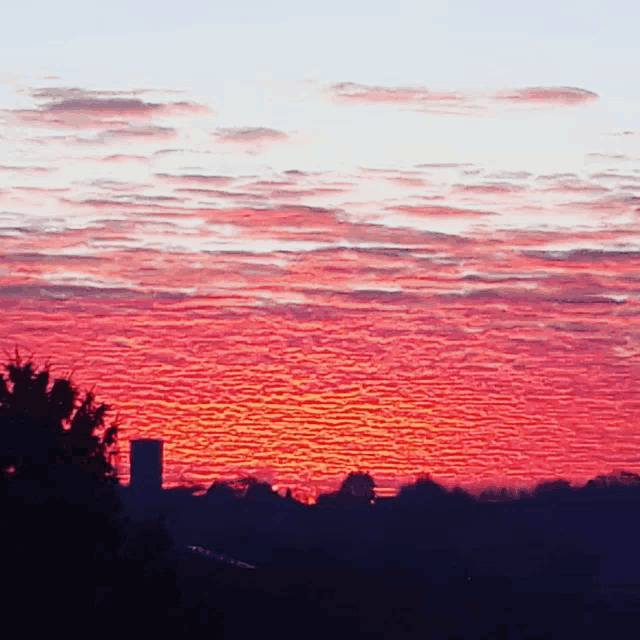 a sunset with a few clouds in it