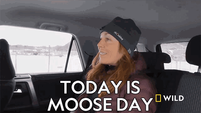 a woman sitting in the back seat of a car with the words today is moose day