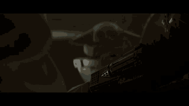 a close up of a person 's face in a dark room .