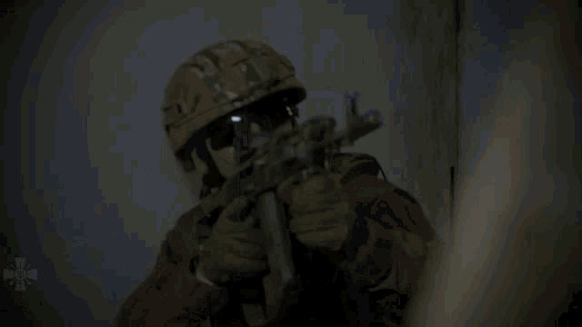 a man in a military uniform has a rifle on his back
