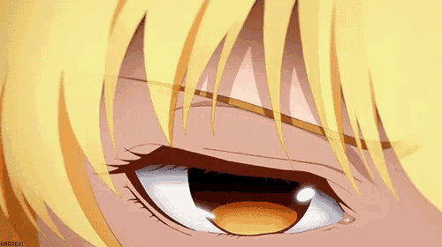 a close up of a person 's eye with a yellow hair .