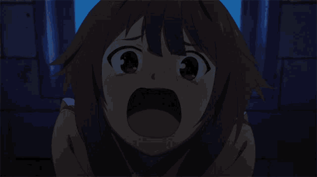 a close up of a girl 's face with her mouth open