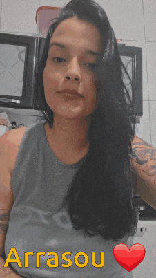 a woman wearing a grey tank top with arrasou written on the bottom