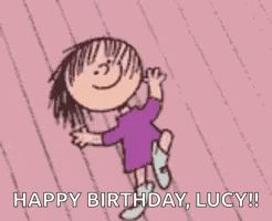 a cartoon girl is dancing on a pink background and saying `` happy birthday , lucy '' .