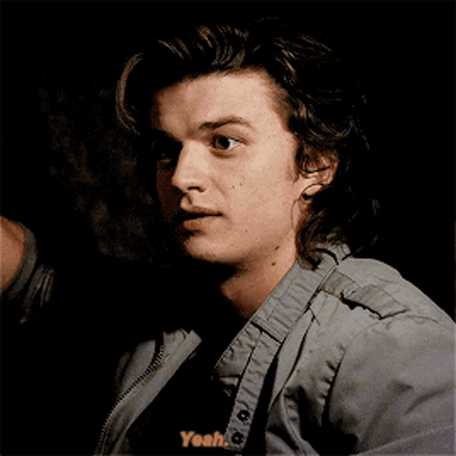 a close up of a man 's face with the words " yeah " on the bottom