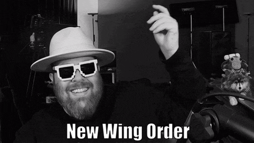 a man with a beard wearing sunglasses and a hat says new wing order
