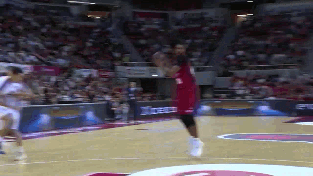 a basketball player in a red uniform with the number 23 on it