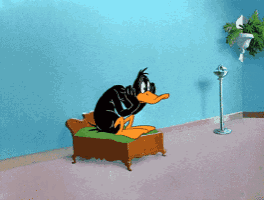 a cartoon of daffy duck sitting on a small couch