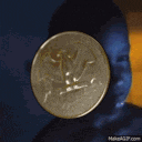 a coin is sitting in front of a child 's face .