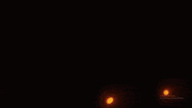 a close up of a person 's face with flames coming out of it 's mouth .