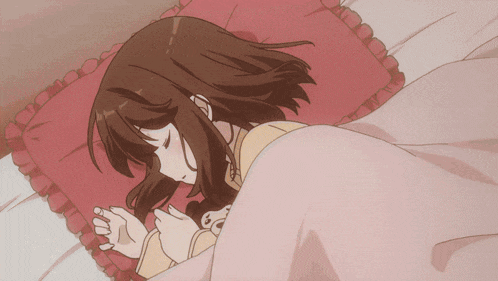 a girl sleeping on a bed with a pink blanket
