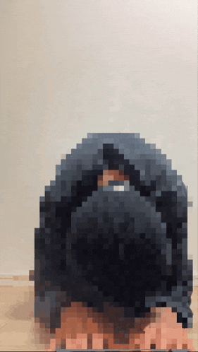 a pixelated image of a person 's head with a white background