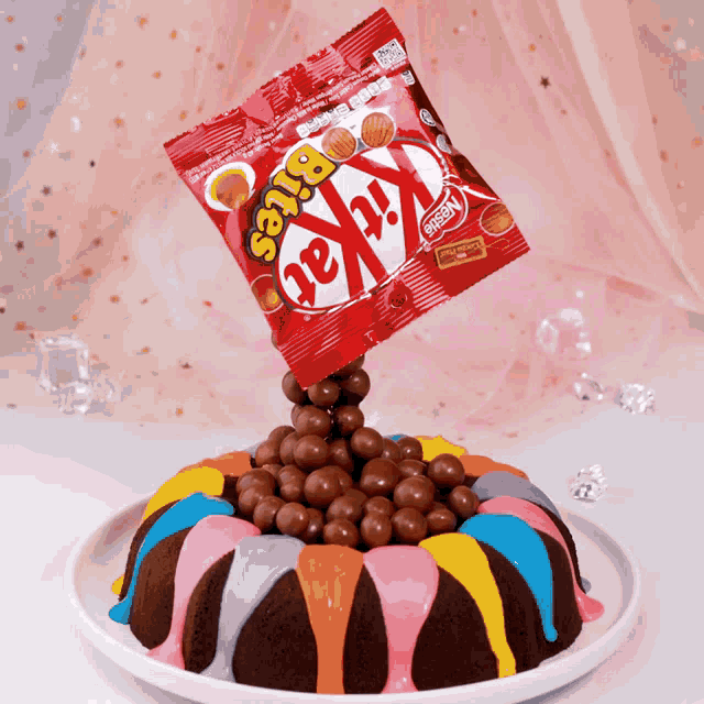 a kitkat bites bag is being thrown into a cake