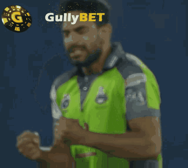 a man in a green shirt with the word gullybet on the top