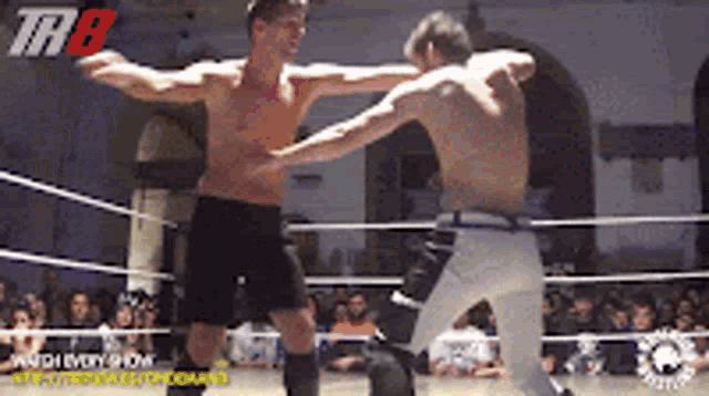 two men are fighting in a wrestling ring with the letters thb on the top