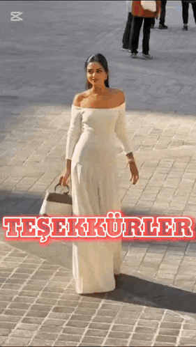 a woman in a white off the shoulder dress is holding a purse