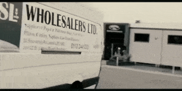 a white van that says sl wholesalers ltd. on the side