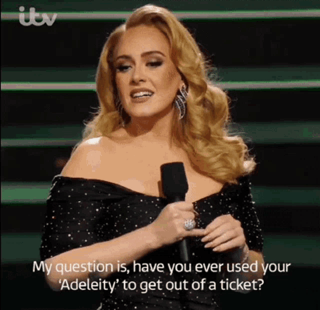 a woman speaking into a microphone with the words my question is have you ever used your ' adeleity '
