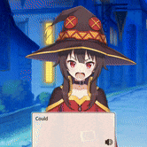 a girl in a witch hat is holding a laptop with the word could on it