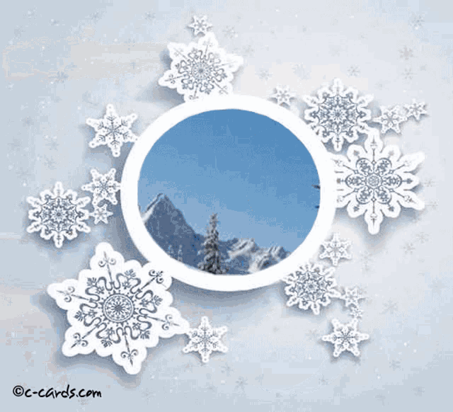 a picture of snow covered trees and mountains in a circle with snowflakes
