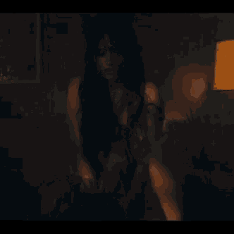 a blurry picture of a person riding a bike at night