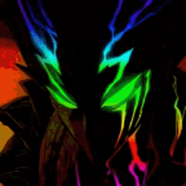 a close up of a person 's face with a rainbow of colors coming out of it .